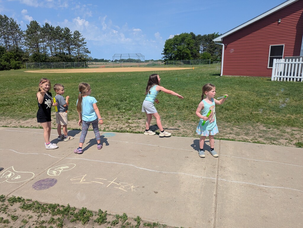 Students playing with bubbles.