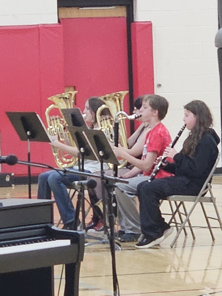 Students playing instruments.