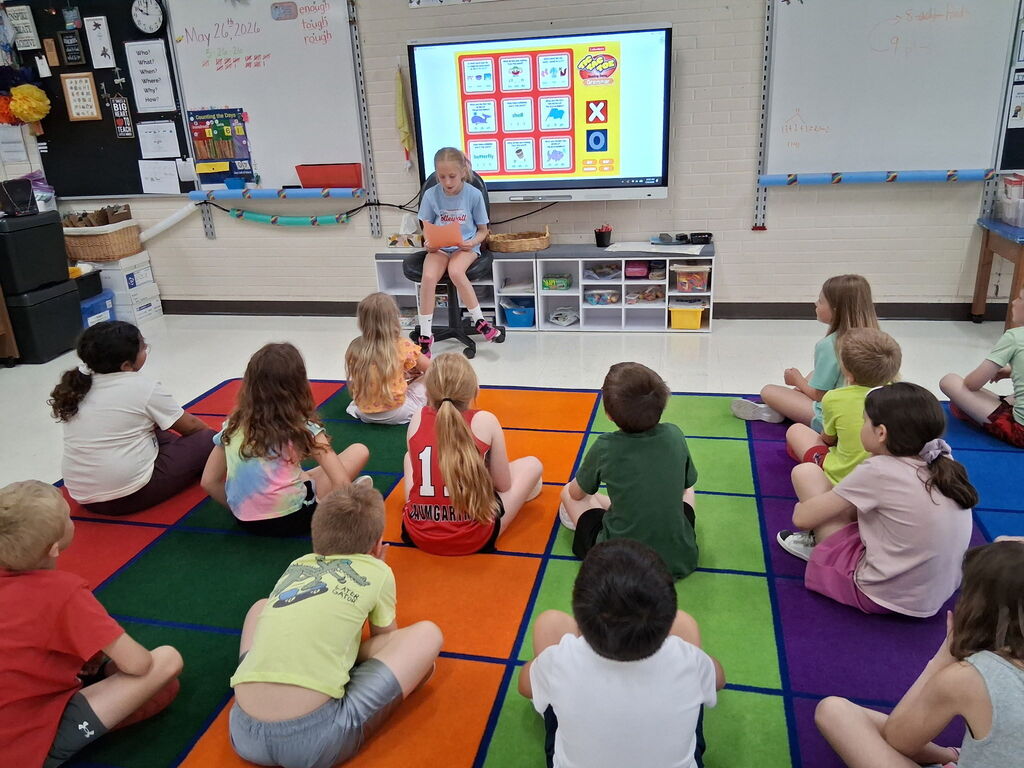 Principal Alaina helping in the classroom