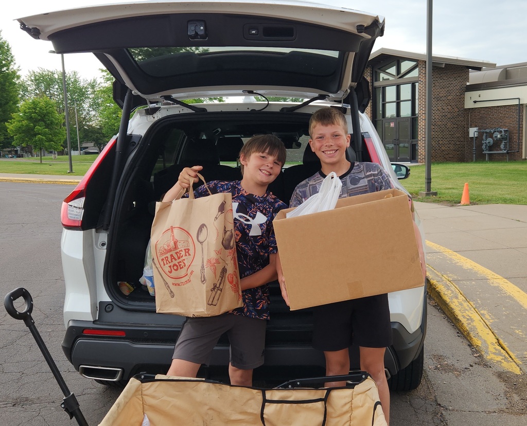 Owyn and Austin loading the donations.
