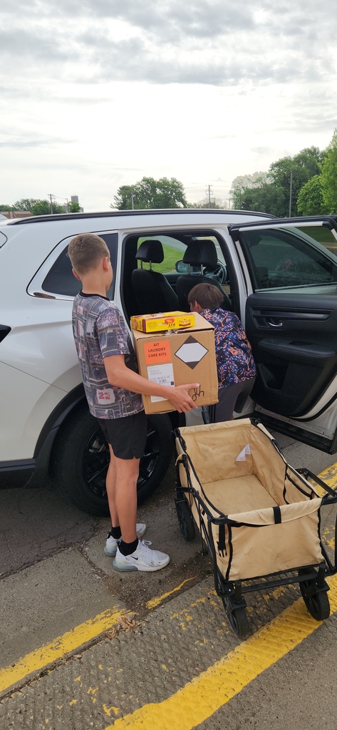 Kids working hard loading the donations.