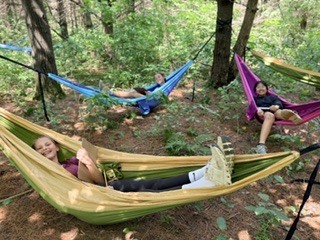 Students in hammocks reading.