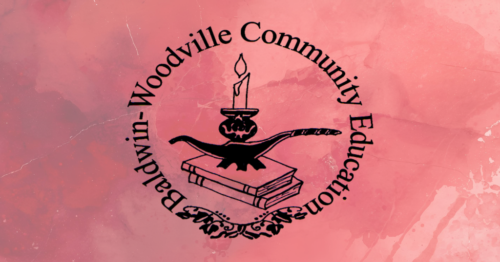Alt Text: Logo for "Baldwin-Woodville Community Education" set against a textured, pink watercolor background. The circular black logo features text arranged along the top arc that reads "Baldwin-Woodville Community Education" with a decorative scrollwork ornament at the bottom. Inside the circle, an illustration shows a lit candle sitting atop a classic lamp of learning, which rests on a stack of two closed books.