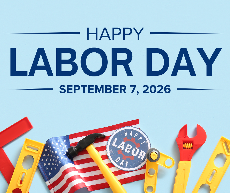 Graphic with dark blue text reading "HAPPY LABOR DAY SEPTEMBER 7, 2026" set against a light blue background. Below the text, toy tools—including a level, hammer, and wrench—lay alongside a small American flag and a blue circular graphic that reads "HAPPY LABOR DAY."