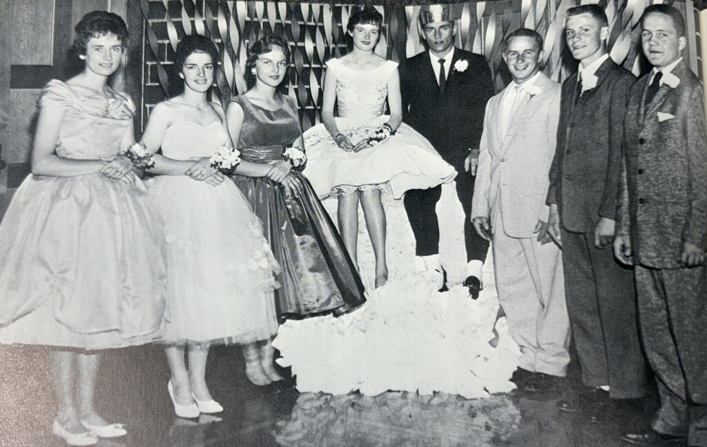 Black-and-white vintage yearbook page showing the Baldwin-Woodville Homecoming Royalty and Court in formal gowns and suits.