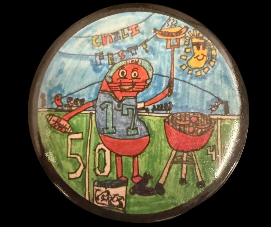 A round, hand-drawn design for a 2026 Chili Fest button. It features a cartoon chili pepper character wearing a football helmet and jersey with the number 17, holding a football and a fork with a grilled hot dog, standing next to a barbecue grill on a football field. The top reads "Chili Fest!" and a smiling sun bean shines overhead.