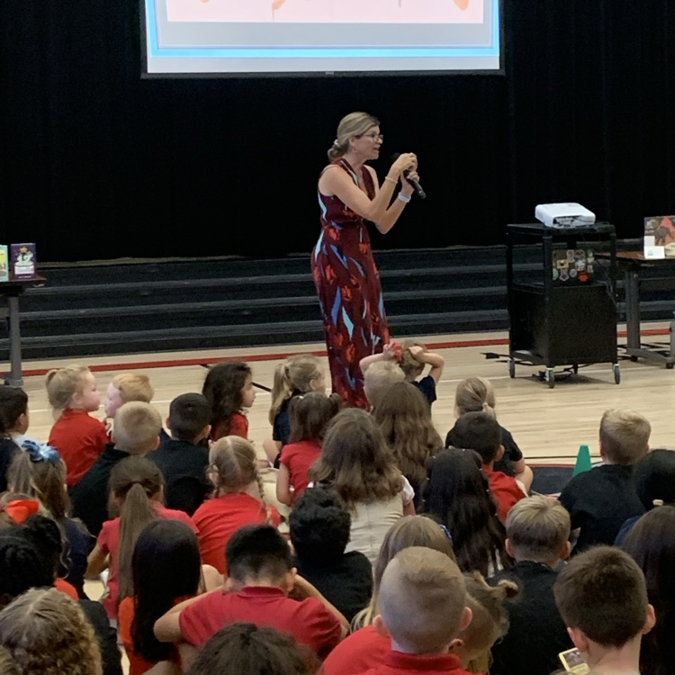 author speaking to a group of kids