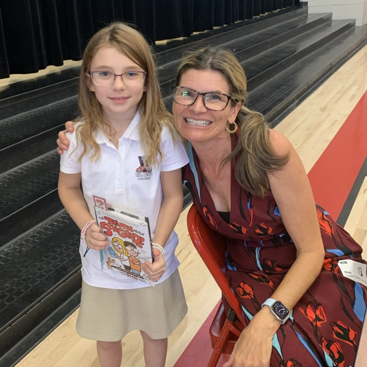 kid smiling with author 