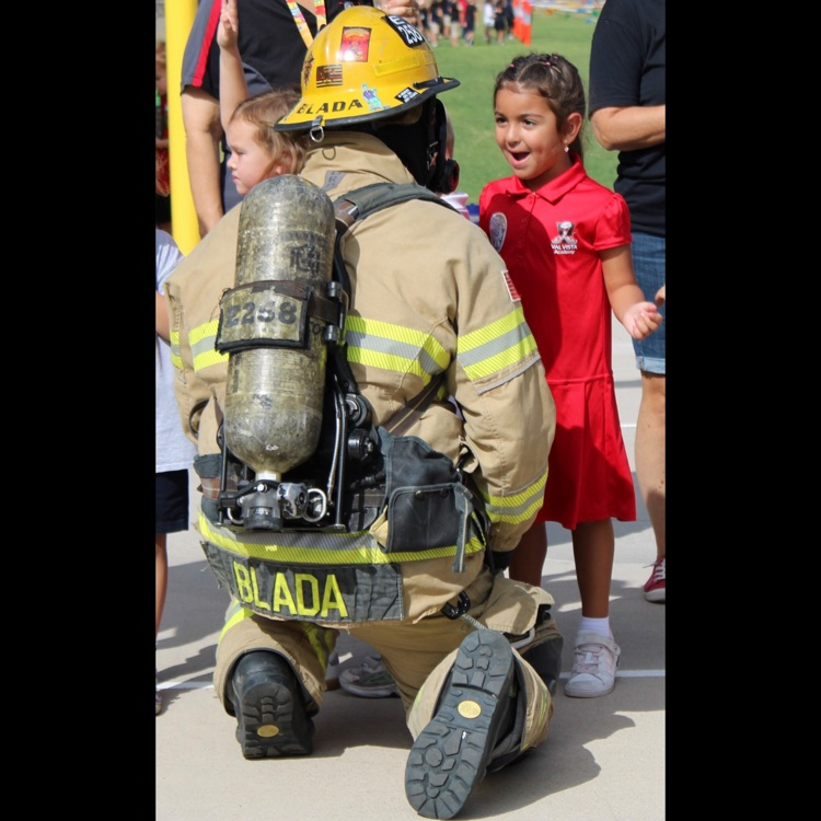 little girl with firefighter