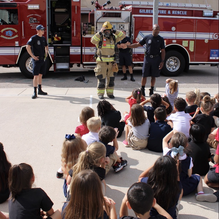 students watching firefighters