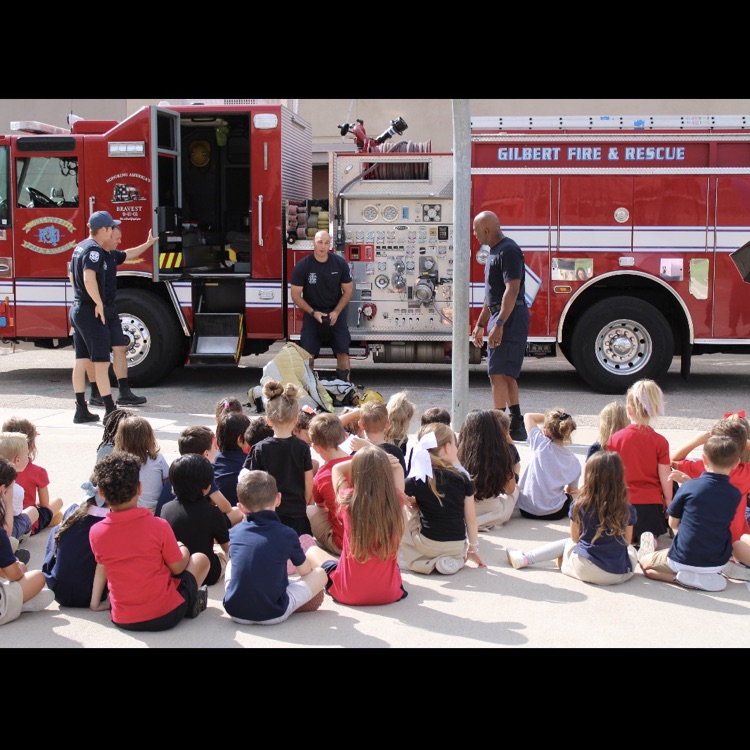 students watching firefighters