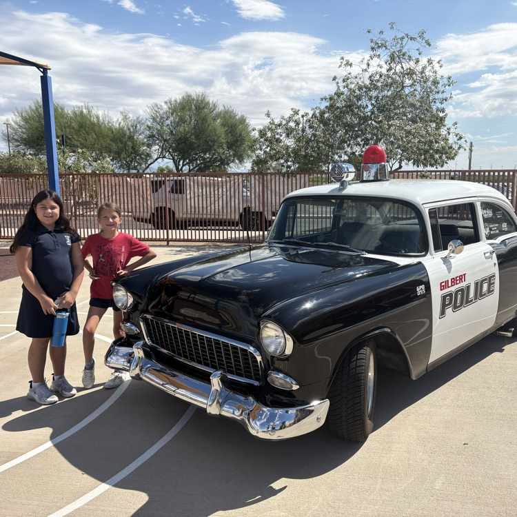 students with police car