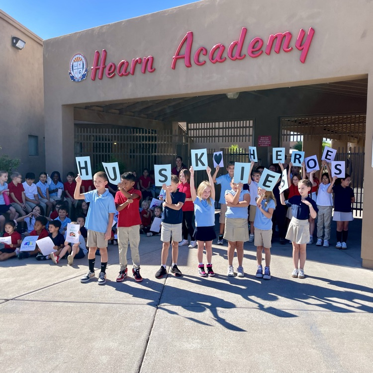 kids with hero sign