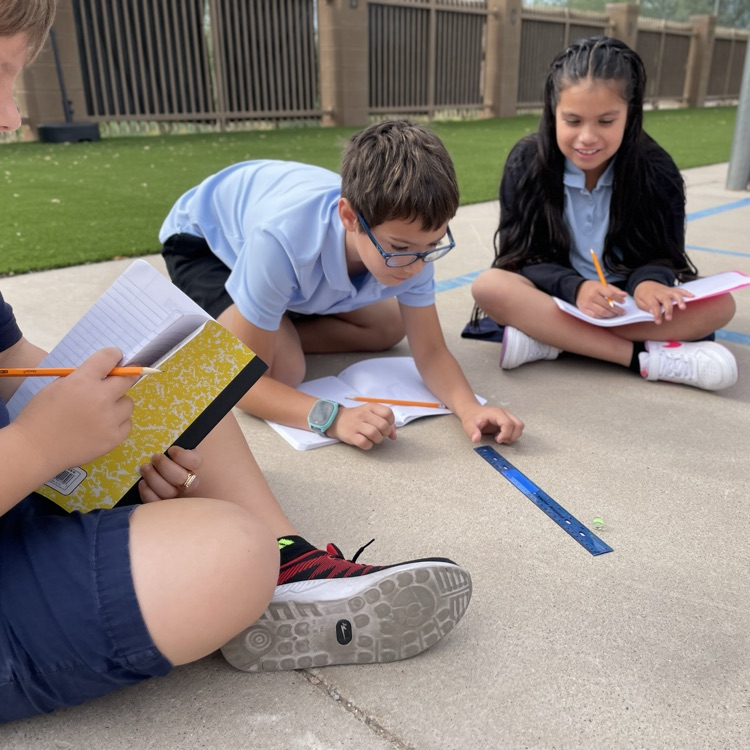 kids measuring marbles 