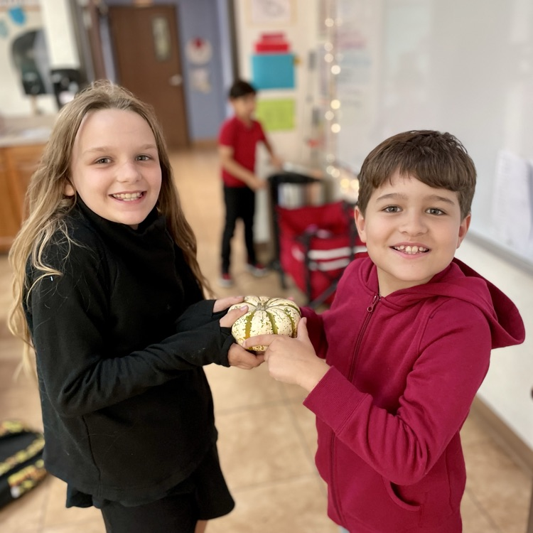 kids with pumpkin