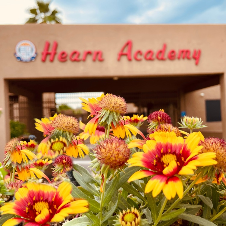 school building with fall flowers
