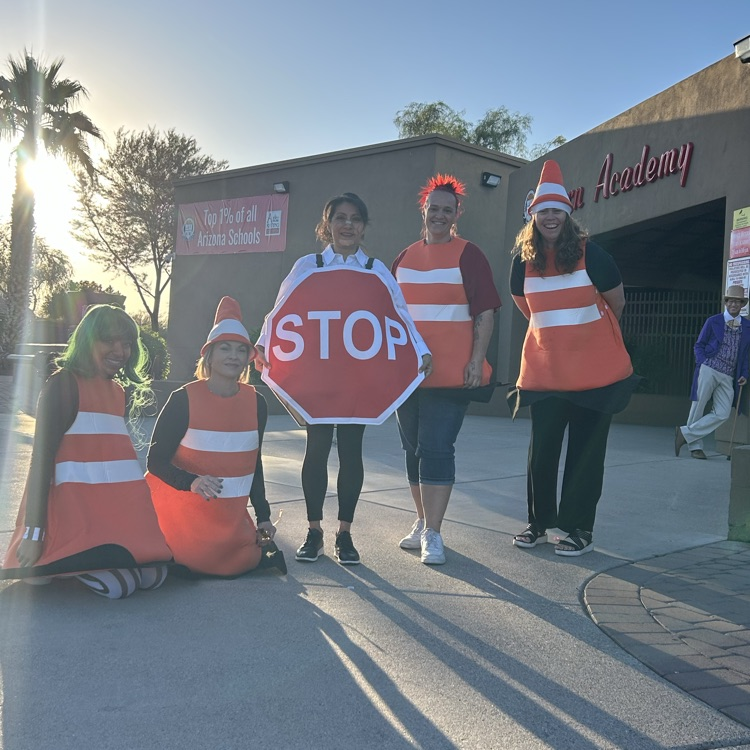teachers in traffic themed costumes