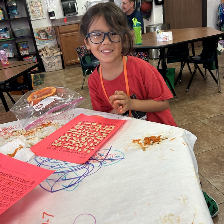 child counting seeds