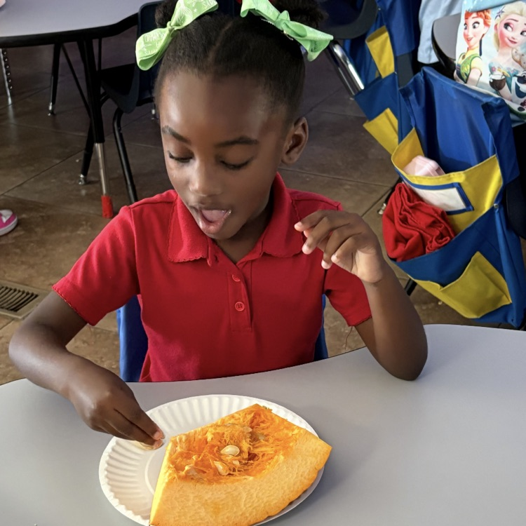 child exploring pumpkin