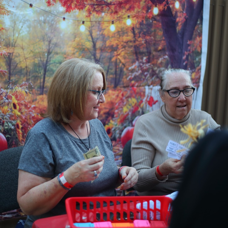 teachers counting tickets
