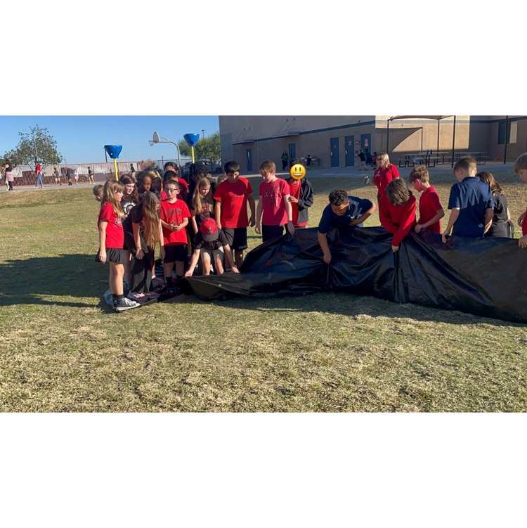 students standing on a tarp