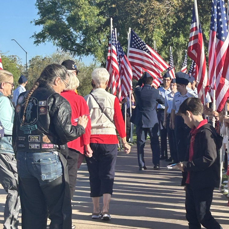student passing out card