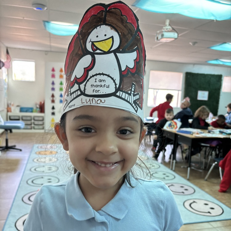 child in turkey hat