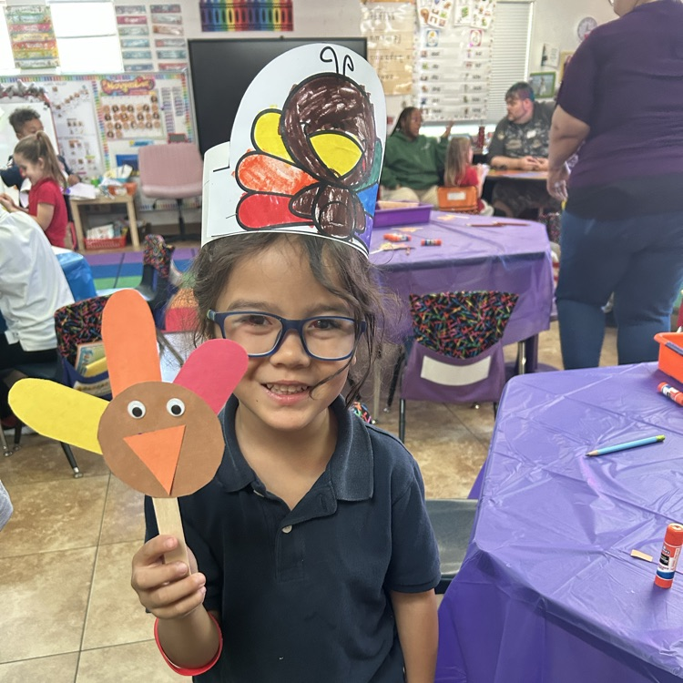 child with turkey craft