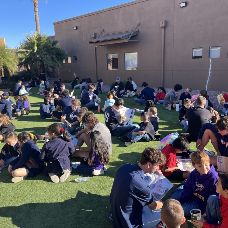kids reading with baseball players 