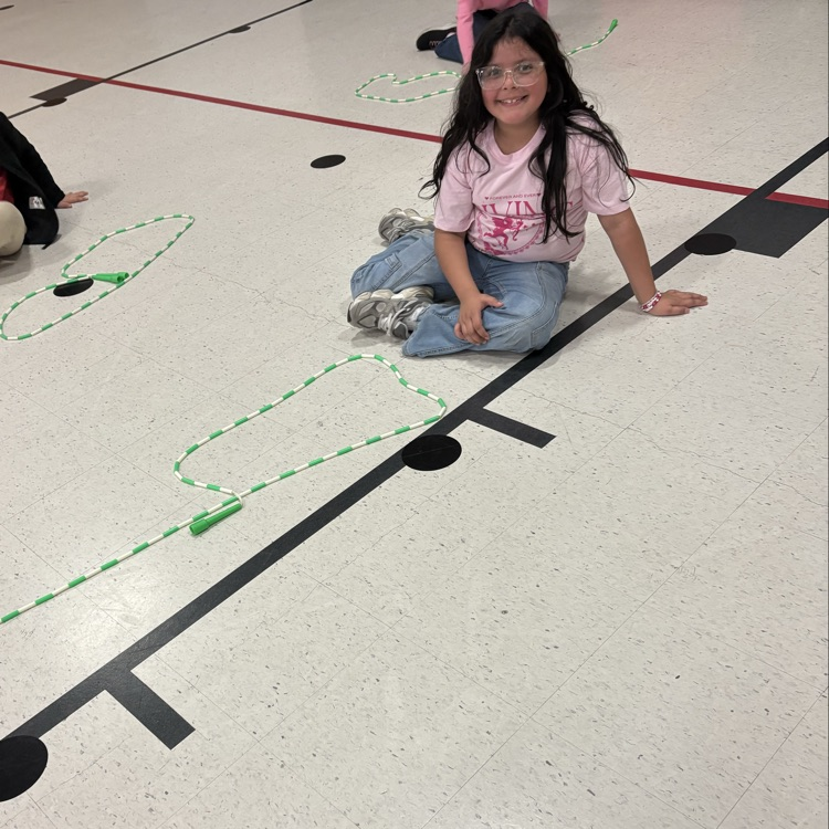 child with rope letter