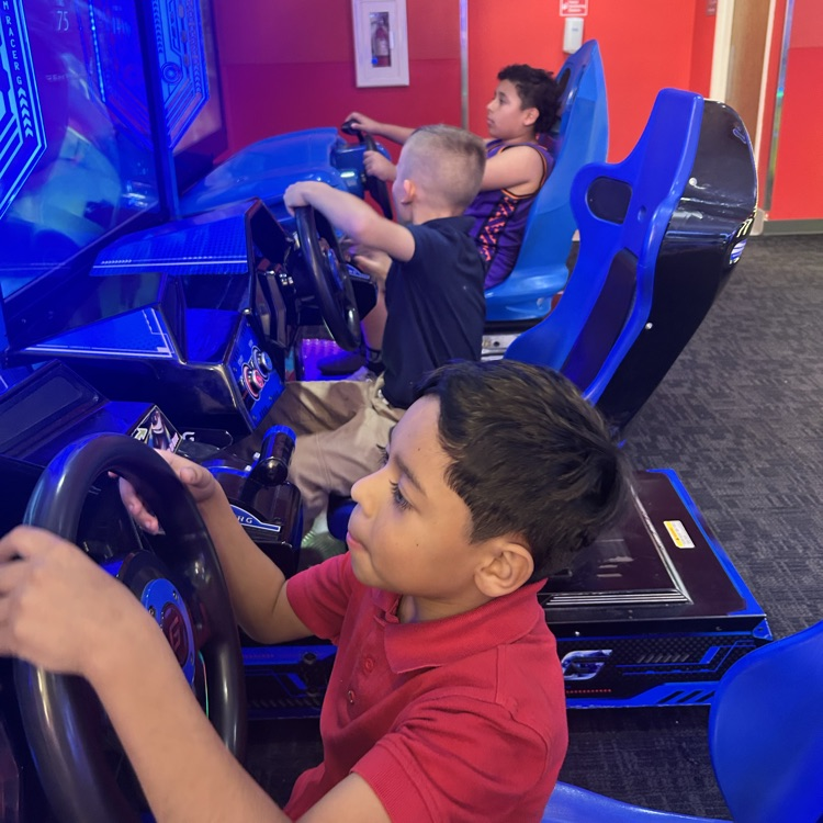 kids playing a racing game 