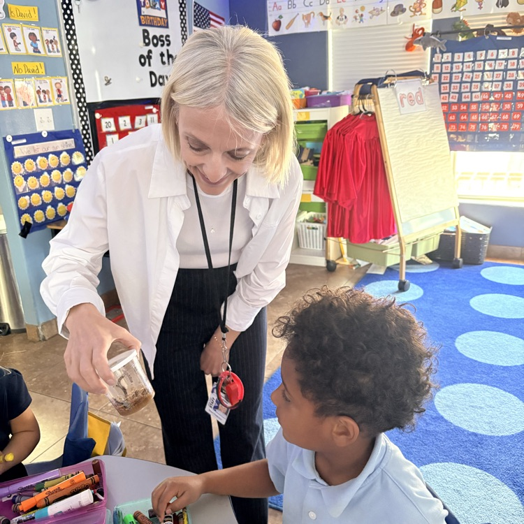 teacher showing caterpillars