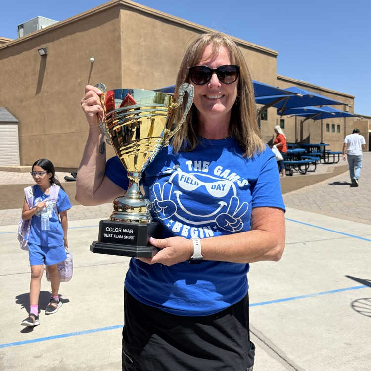 teacher with trophy