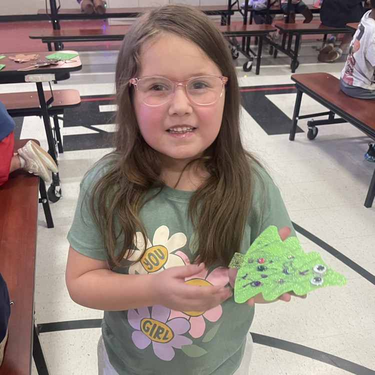 child with tree craft