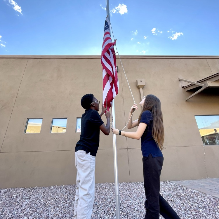 kids hanging the flag