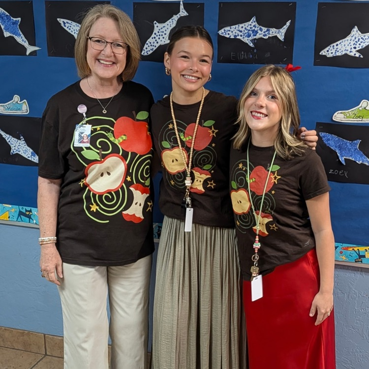 teachers in apple shirts 