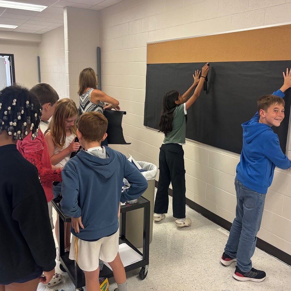 GIS leaders posting on the bulletin board.