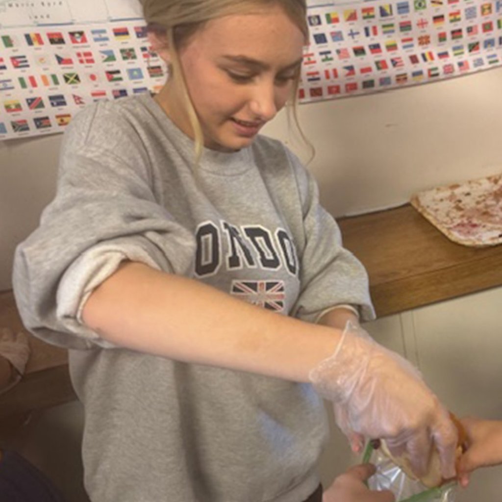 GMS students simulating an assembly line in Mr. Hummel's class