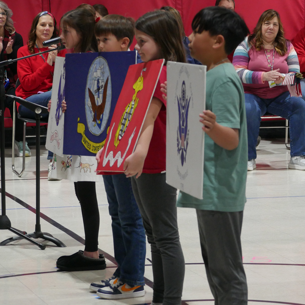 CES students performing in the Veterans Day Assembly.