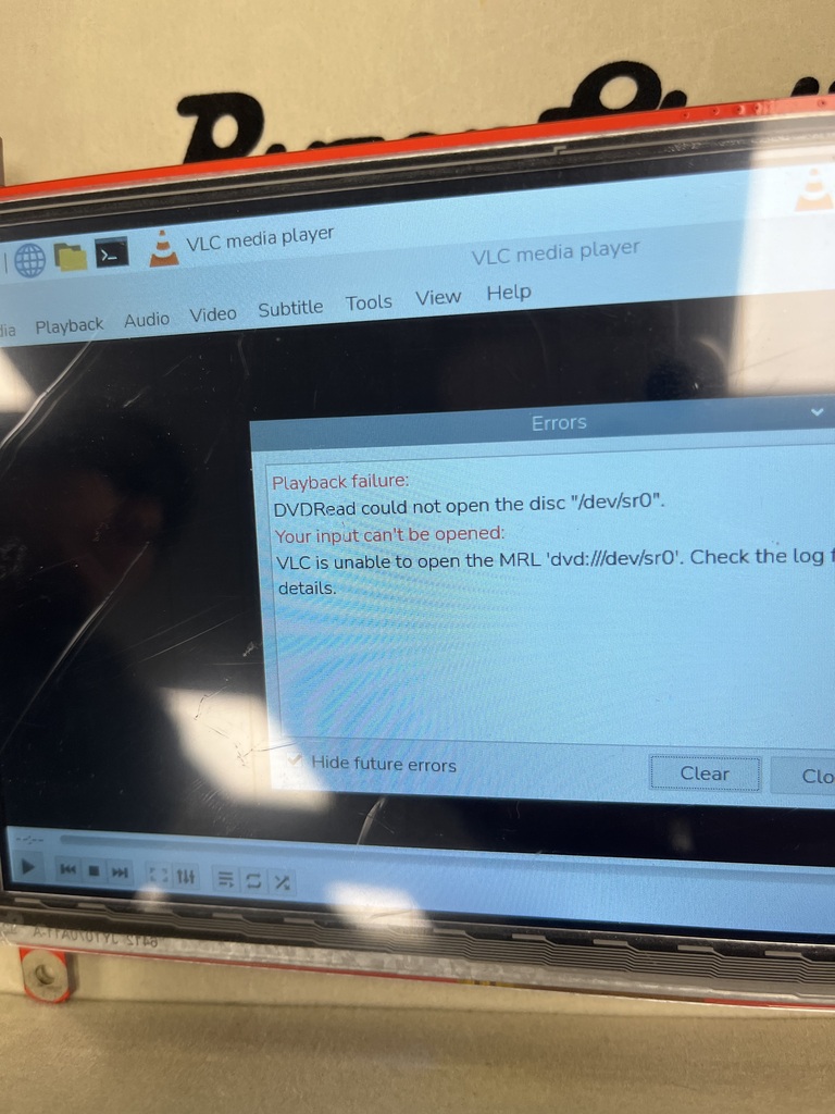 Close-up of a computer screen displaying a VLC Media Player error indicating that the program is unable to read or open a disc.