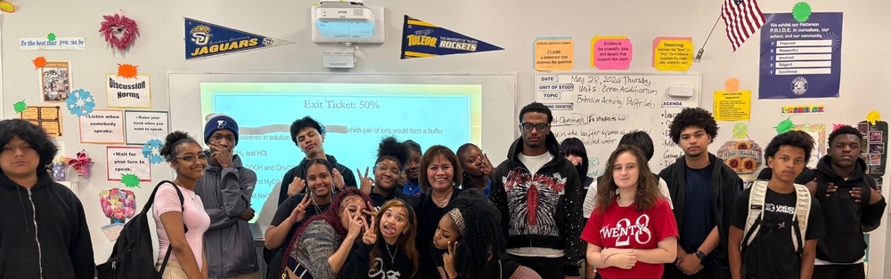 A group of students and an adult in a classroom setting