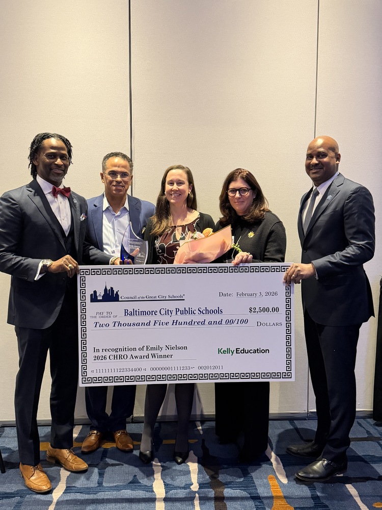 group photo of Chief Nielson holding award