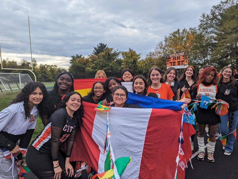 City College Students pose with flags in celebration of hispanic heritage month.