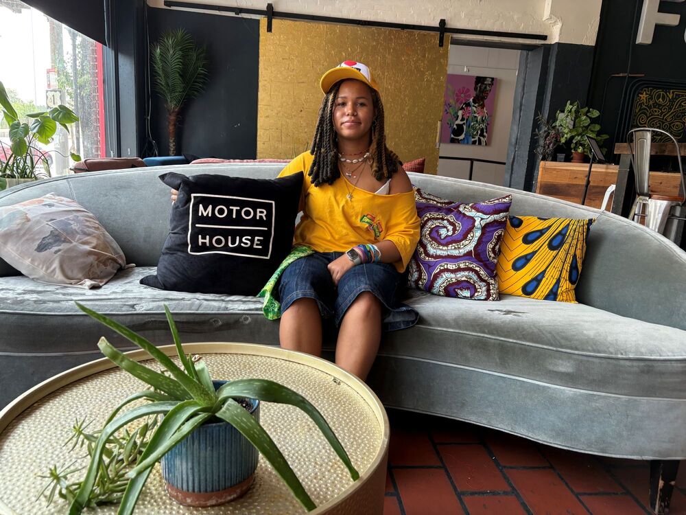 Baltimore City College senior Zoë Lashley sitting on couch