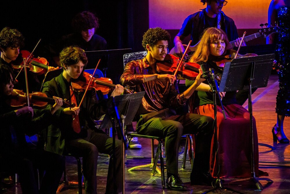 City schools music students performing on stage