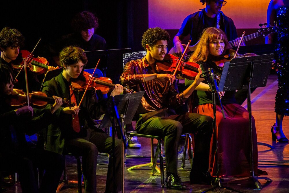 City schools music students performing on stage
