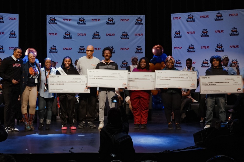 DTLR Scholarships being presented to students on the stage at a CIAA event