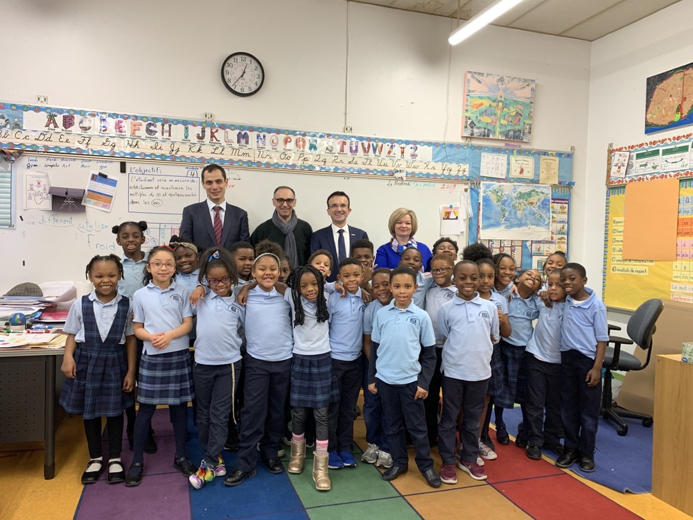 students, principal, and staff at BIA posing for a group photo