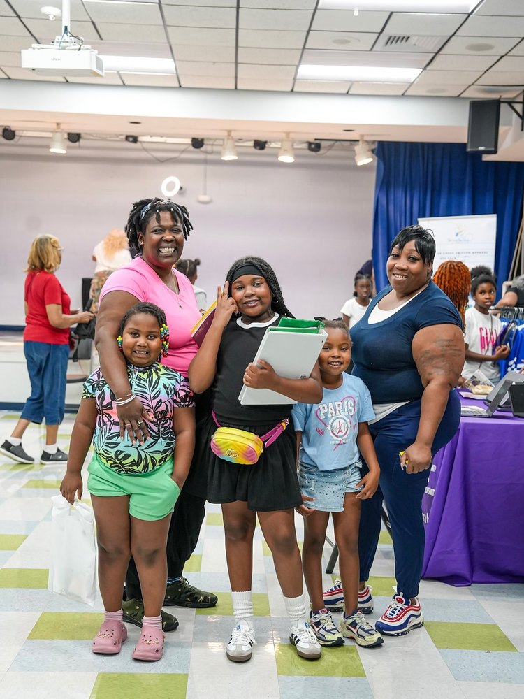 Students and family pose for a picture at back to school night.
