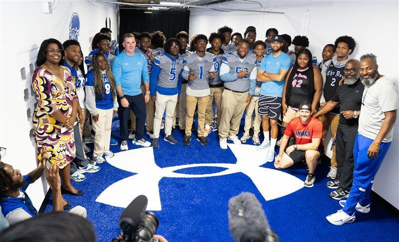City Schools CEO Dr. Sonja Brookins Santelises, Mayor Brandon Scott, UA Founder Kevin Plank, NBA champion Stephen Curry, and PGA golf pro Jordan Spieth with Carver students